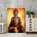 Tableau Bouddha assis devant une bougie